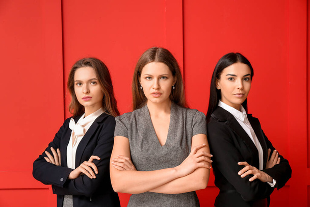 Beautiful young businesswomen on color background - Photo, Image