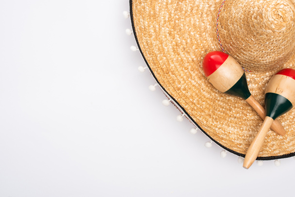 Top view of sombrero and maracas on white background - Photo, Image