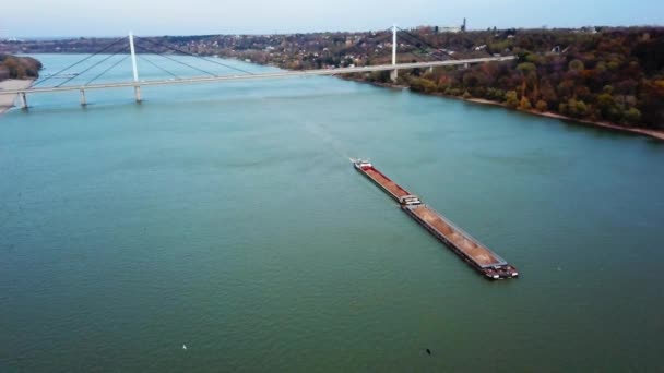 Aerial view of cargo ship full with material transporting goods over Danube - Footage, Video