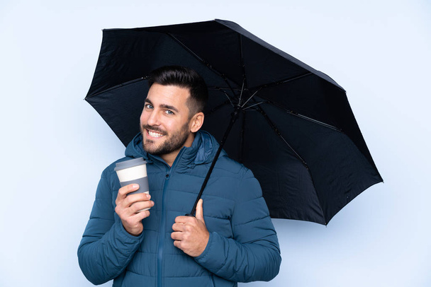 Homme tenant un parapluie sur fond isolé
 - Photo, image