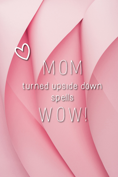 top view of pink paper swirls with mom wow lettering - Fotoğraf, Görsel