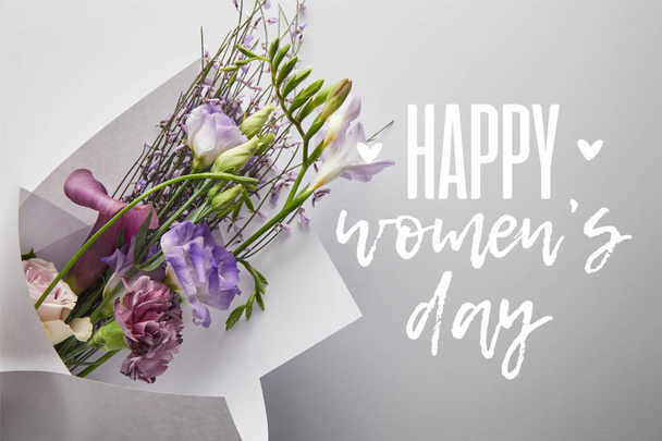 top view of violet bouquet wrapped in paper on white background, happy womens day illustration  - Fotoğraf, Görsel