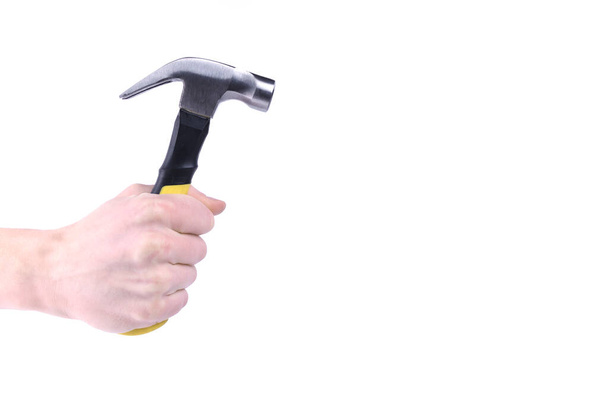 Hand holds hammer isolated on white background a - Photo, Image