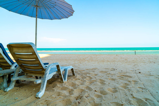 empty beach chair on sand with ocean sea background - 写真・画像