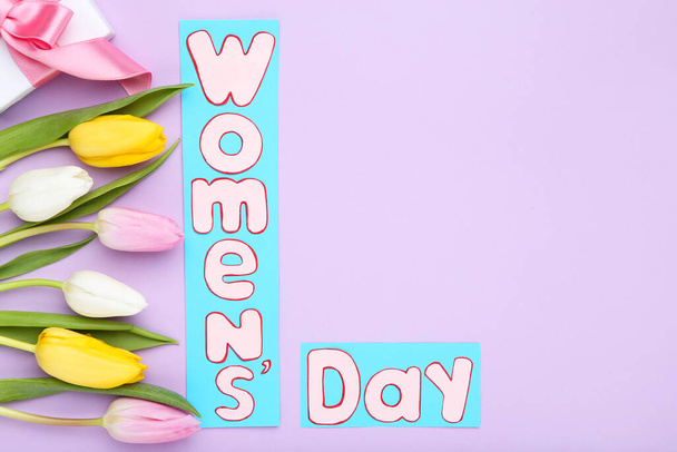 Text Womens Day with tulip flowers on purple background - Φωτογραφία, εικόνα