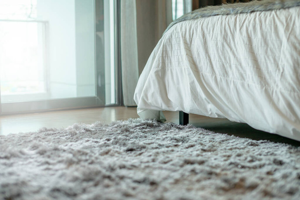 bedroom  interior detail with carpet and light from window - Foto, Imagen