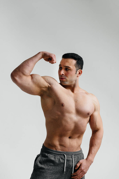 Sexy athlete posing on a white background Topless. Fitness - Fotografie, Obrázek