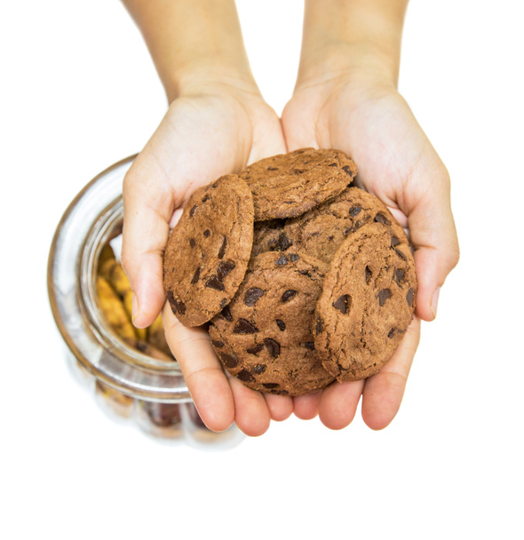vrouwelijke handen aanbod cookies - Foto, afbeelding
