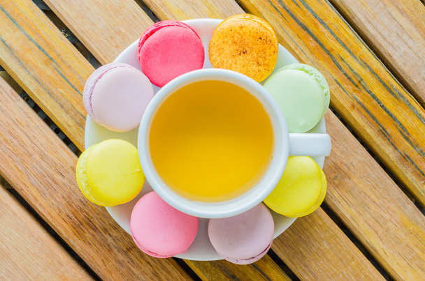 Colorful macaroon with white cup tea - Photo, Image