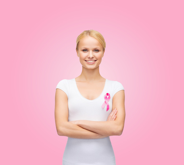 Woman in blank t-shirt with pink cancer ribbon - Fotoğraf, Görsel
