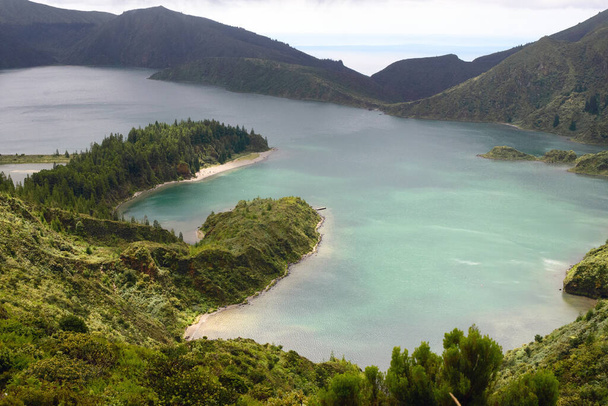 The beautiful crater of Lake Lagoa do Fogo in the stratovolcano Agua de Pau Massiva in the center of the island of San Miguel on the Portuguese archipelago of the Azores. Travel to the Azores. - 写真・画像