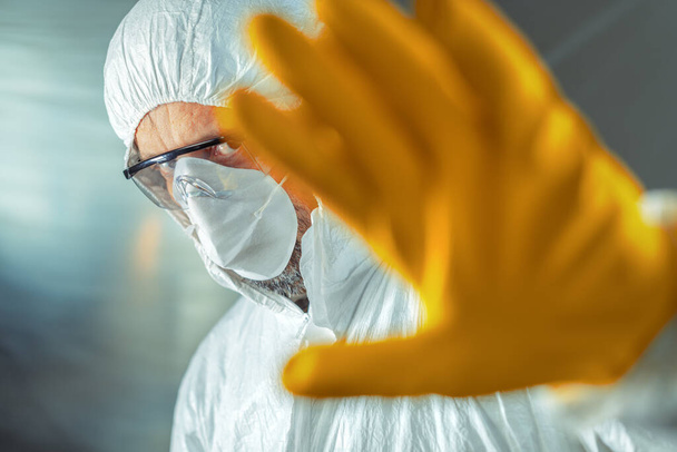 Medical worker gesturing stop hand sign in hospital quarantine, selective focus - Foto, Imagem