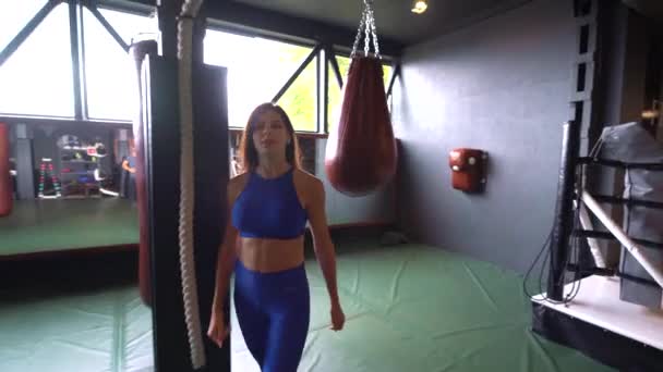 Young beautiful woman doing simple exercises and stretching - Séquence, vidéo