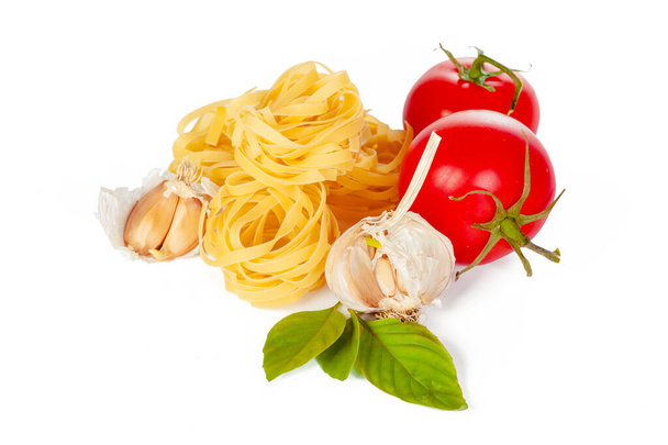 Raw tagliatelle pasta isolated on white background. - Fotó, kép