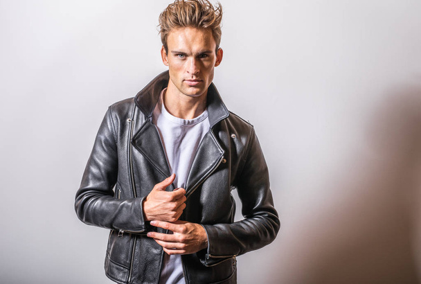Handsome young man in classic leather jacket. - Foto, imagen