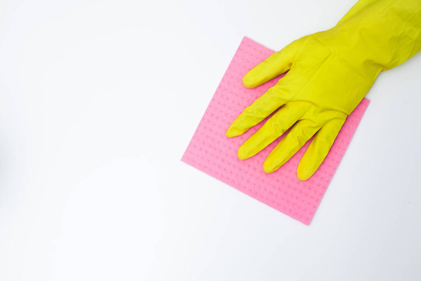 Young woman in gloves cleaning office table - Photo, Image