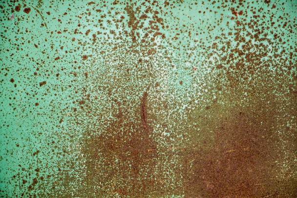 The grain texture of the old rusty metal. Background of grained rusty iron closeup. - Photo, image