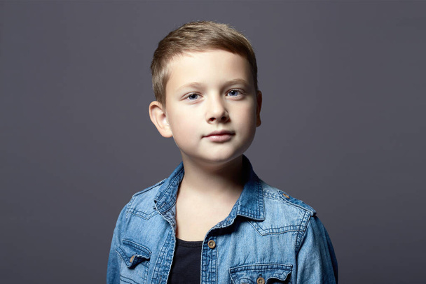 portrait of child. handsome little boy in jeans wear. 10 years old kid - 写真・画像