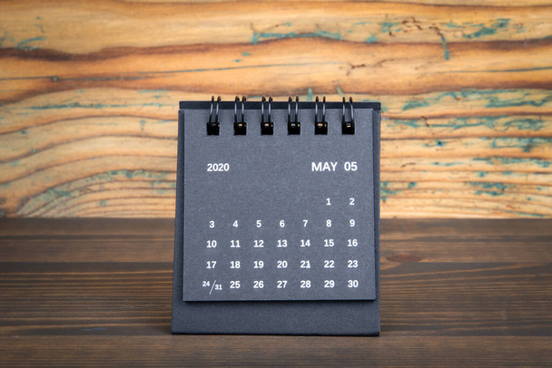 2020 May. Black paper calendar on a wooden table - Photo, Image