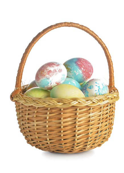 Basket with beautiful Easter eggs on white background - Foto, Bild