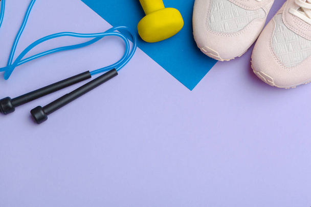 Fitness Gym equipment on color background. creative photo. - Φωτογραφία, εικόνα