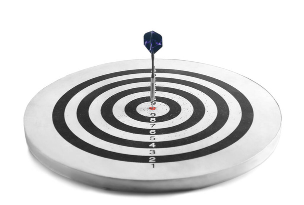Dartboard with hit bullseye on white background - Photo, Image