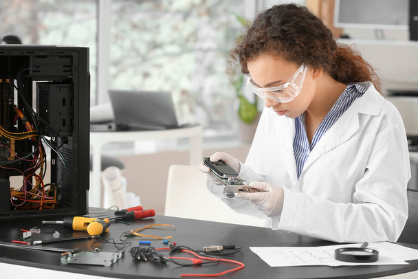 Electronic technician working in service center - Photo, Image