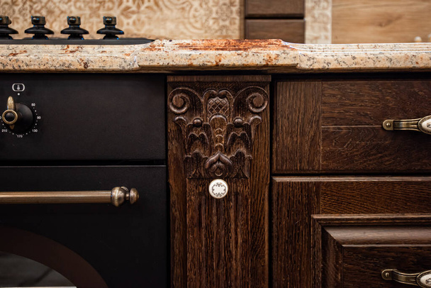 Design element of classic kitchen furniture. Wood carving. Copy space. - Fotó, kép