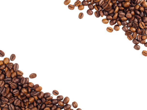 Close-up and top view of roasted Thai coffee beans and empty area for copy space on white background for used as background, backdrop or banner - Photo, Image