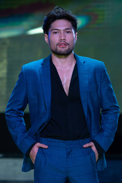Bangkok, Thailand - August 28, 2019 ; Asian Man Contest named Mister Supranational Thailand 2019, Handsome Contestants present Fashion show in formal suit Dress at Suan Lum Night Bazaar Hotel - Foto, afbeelding