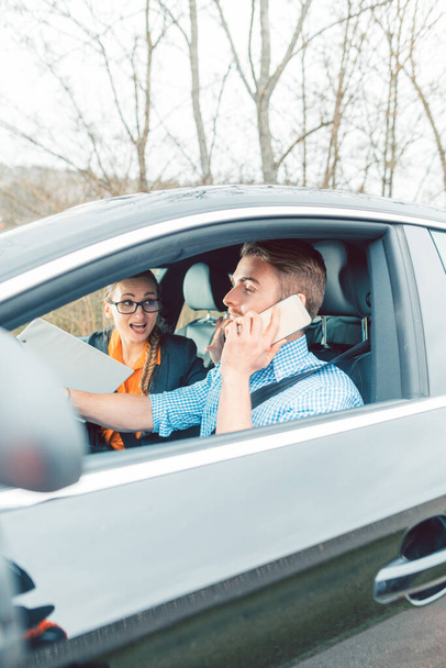 Driving instructor being mad at student using his telephone while driving - Photo, Image