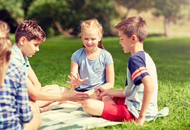 happy kids playing rock-paper-scissors game - Photo, Image