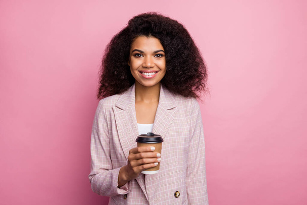 Positive cheerful afro american girl investor agent relax after company career conference hold mug caffeine beverage wear style stylish jacket isolated pastel pink color background - Фото, зображення