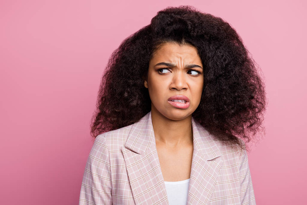 Omg what disgust. Frustrated upset afro american woman marketer look copyspace dislike office smell grimace face wear suit isolated pastel pink color background - Photo, Image