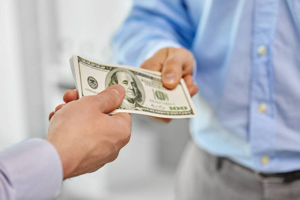 close up of businessmens hands holding money - Фото, зображення