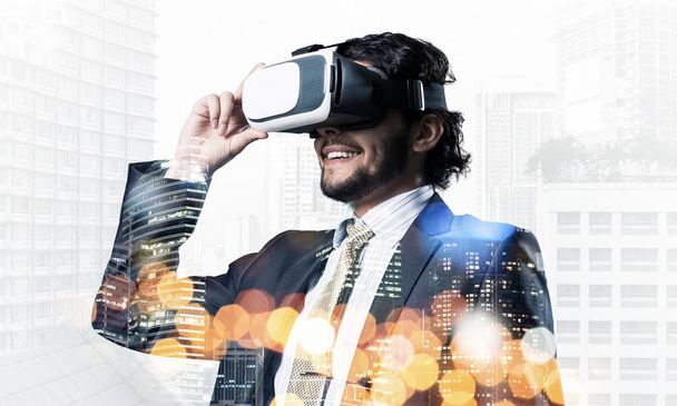 Double exposure of businessman in virtual helmet against cityscape background - Фото, зображення