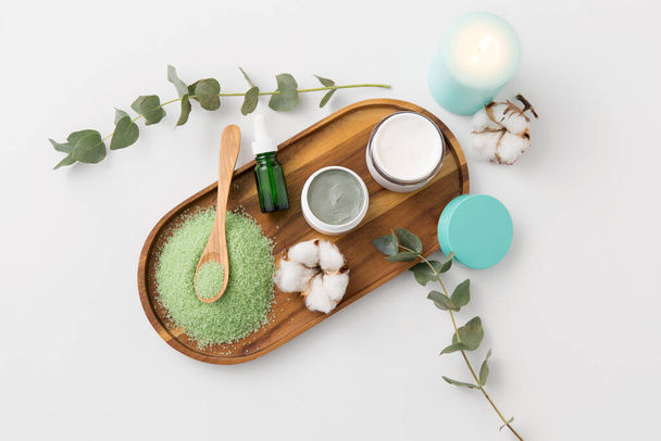 bath salt, serum, moisturizer and oil on tray - Фото, зображення