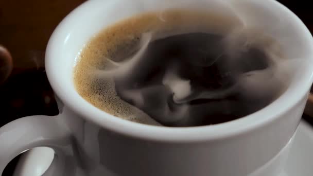 Hot coffee in a cup with steam on an old background. - Filmmaterial, Video