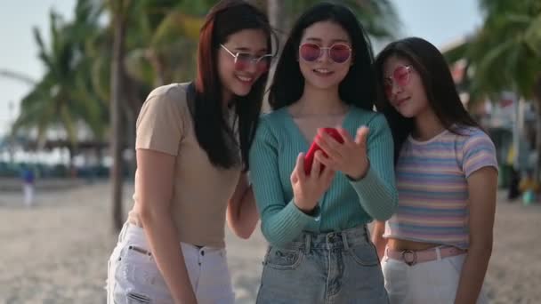 Asian women travel at the beach on summer holiday, Thailand. Relax and recreation, having fun with friend. - Filmati, video