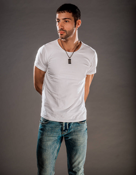 Studio body shot of a fashion male model wearing stylish clothes - Valokuva, kuva