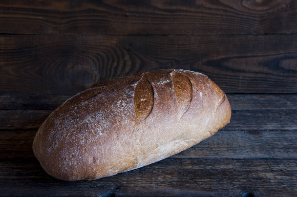 Rye bread. Homemade baking. On a wooden background. - Foto, Imagem