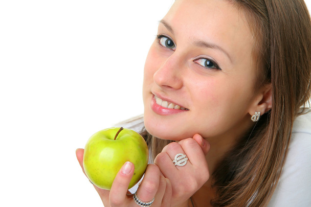 The beautiful girl with apple - Фото, изображение