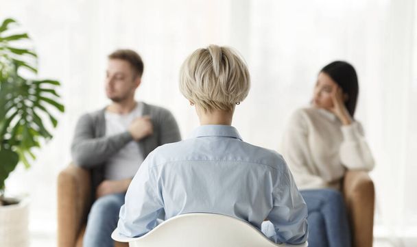 Family Counselor Talking With Couple Sitting In Office, Back View - Photo, Image