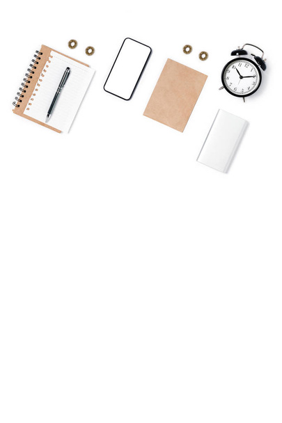 Modern workspace with smartphone, notepad, pen and alarm clock. Flat lay, top view, copy space. - Zdjęcie, obraz