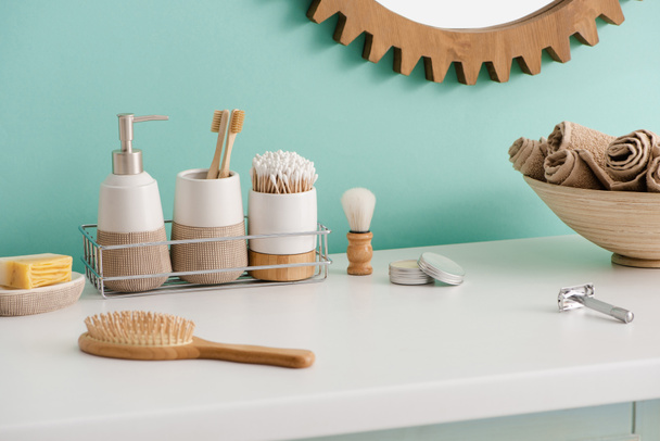 Various hygiene objects, bowl with towels and mirror in bathroom, zero waste concept - Photo, Image