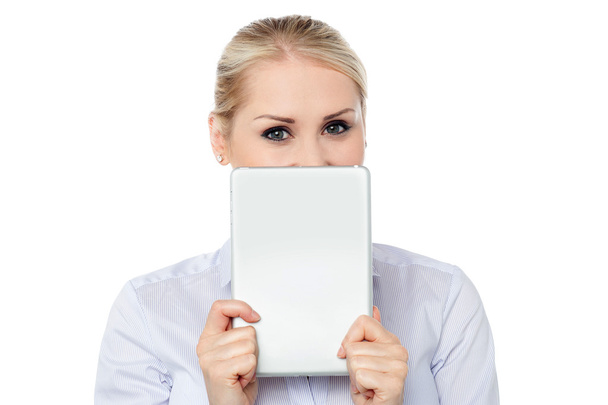 Female model hiding face with tablet pc - Φωτογραφία, εικόνα