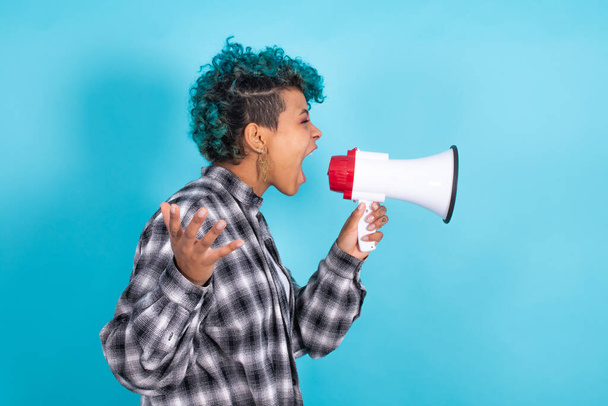 african american girl or woman with megaphone isolated on blue background - Photo, Image