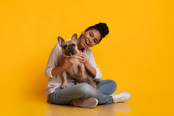 Young Beautiful Afro Woman Posing With Ger Cute Dog In Studio - Φωτογραφία, εικόνα