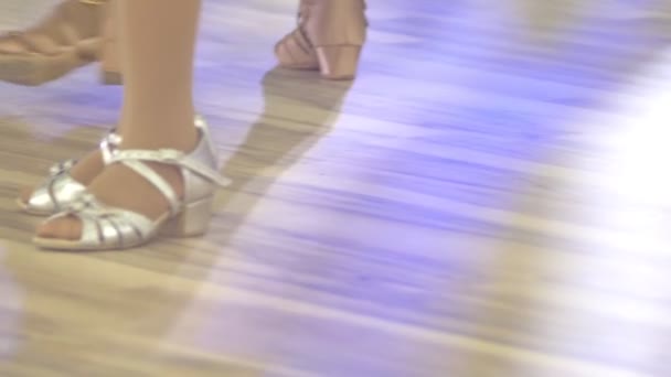 closeup, legs of children in shoes for ballroom dancing, dancing on the floor - Кадры, видео