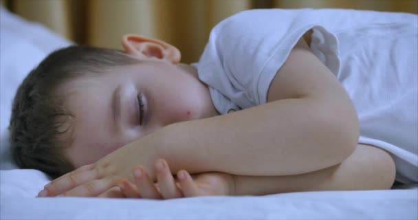 Cute Little Boy is Sleeping Sweetly in Bed, Concept of Baby Sleep. - 映像、動画